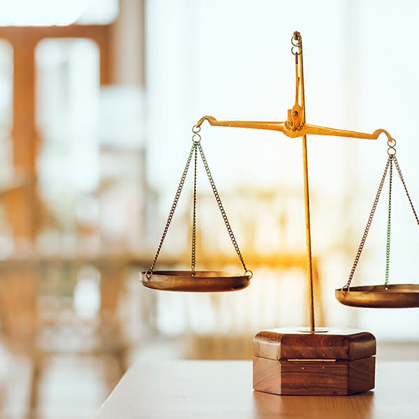 A photograph of brass weighing scales.